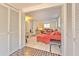 Inviting living room featuring tiled floors and comfortable red couches, perfect for relaxation and gatherings at 10119 Cliff Cir, Tampa, FL 33612