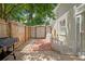 Enclosed backyard showcasing a storage shed, baby gate, and brick walkway at 11026 Austin Ct, New Port Richey, FL 34654