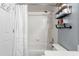 Bathroom with a bathtub/shower combination and shelves at 11026 Austin Ct, New Port Richey, FL 34654