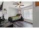 Bedroom with wood-look flooring, desk, and ample natural light at 11026 Austin Ct, New Port Richey, FL 34654