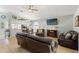 Open-concept living room with dining area and kitchen access at 11026 Austin Ct, New Port Richey, FL 34654