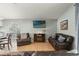 Cozy living room with a fireplace and comfortable leather seating at 11026 Austin Ct, New Port Richey, FL 34654