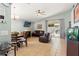 Comfortable living room with tile flooring, vaulted ceiling, ceiling fan and sliding glass doors to the patio at 11026 Austin Ct, New Port Richey, FL 34654