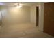 A simple bedroom with neutral walls, basic carpet, a ceiling fan, and a closet with a closed door at 1146 Alma St, Clearwater, FL 33756