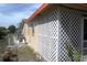 Tan exterior of home features lattice on the side and an orange roof at 1146 Alma St, Clearwater, FL 33756