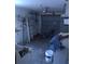 The garage features lighting, a ladder, some shelving, and some other materials at 1146 Alma St, Clearwater, FL 33756