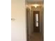 Hallway with white walls, neutral flooring and three closed doors leading to other rooms of the home at 1146 Alma St, Clearwater, FL 33756