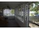 A partially enclosed patio featuring a lattice privacy screen and a ceiling fan for comfortable outdoor living at 1146 Alma St, Clearwater, FL 33756