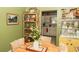 Vintage dining room featuring unique decor and a view into the kitchen at 12213 Floral Ln, Thonotosassa, FL 33592