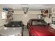 Spacious garage with two cars and ample storage racks along the walls at 12213 Floral Ln, Thonotosassa, FL 33592