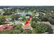 Home with a pond view in a neighborhood with mature trees and landscaping at 1312 Fishing Lake Dr, Odessa, FL 33556