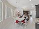 Charming dining room with a view to the kitchen and cozy fireplace at 1312 Fishing Lake Dr, Odessa, FL 33556