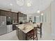 Stunning kitchen with granite countertops, stainless steel appliances, and modern lighting at 1312 Fishing Lake Dr, Odessa, FL 33556