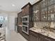 Updated kitchen with stainless steel appliances, granite countertops, and stylish cabinetry at 1312 Fishing Lake Dr, Odessa, FL 33556