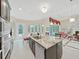 Spacious kitchen featuring a large granite island, stainless appliances, and custom cabinetry at 1312 Fishing Lake Dr, Odessa, FL 33556