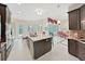 Open-concept kitchen featuring granite countertops and stainless steel appliances at 1312 Fishing Lake Dr, Odessa, FL 33556