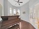 Stylish living room with a piano, harp, and natural light at 1312 Fishing Lake Dr, Odessa, FL 33556