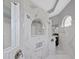 Elegant shower with dual showerheads and beautiful marble-style tile at 1312 Fishing Lake Dr, Odessa, FL 33556