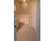 Bathroom showcasing soaking tub, tiled floors, and private toilet area at 13231 Cherry Bark Cir, Riverview, FL 33579