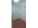 Empty walk in closet with wood floors and wire shelving at 13231 Cherry Bark Cir, Riverview, FL 33579