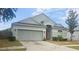 Charming single-Gathering home featuring a two-car garage and well-maintained front yard at 13231 Cherry Bark Cir, Riverview, FL 33579