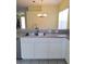 Functional kitchen featuring modern sink, countertop space, and connection to dining area at 13231 Cherry Bark Cir, Riverview, FL 33579