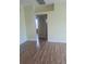 Bright, open living room featuring wood-look floors and neutral paint, ready for your personal touch at 13231 Cherry Bark Cir, Riverview, FL 33579