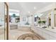 Bright bathroom features double sinks, soaking tub, and stylish finishes at 13553 Glaze Brook Dr, Hudson, FL 34667