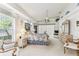 Inviting bedroom with large windows, neutral carpet, and a full dresser at 13553 Glaze Brook Dr, Hudson, FL 34667