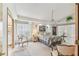 Bright and airy bedroom with large windows, neutral carpet, and classic furnishings at 13553 Glaze Brook Dr, Hudson, FL 34667