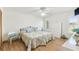 Well-lit bedroom featuring hardwood floors, twin beds, and ample natural light at 13553 Glaze Brook Dr, Hudson, FL 34667