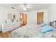 Bedroom showcases hardwood floors, a large dresser, and a serene view at 13553 Glaze Brook Dr, Hudson, FL 34667
