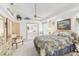 Comfortable bedroom with plush carpet, a large window and an attached bathroom at 13553 Glaze Brook Dr, Hudson, FL 34667