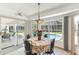 Breakfast nook with large glass windows overlooking a screened in pool at 13553 Glaze Brook Dr, Hudson, FL 34667