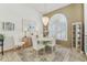 Elegant dining room featuring chandelier, natural light, and stylish accents at 13553 Glaze Brook Dr, Hudson, FL 34667