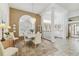 Formal dining room with chandelier, neutral decor, and a view of the entryway at 13553 Glaze Brook Dr, Hudson, FL 34667