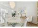 Bright dining room features chandelier lighting and neutral decor at 13553 Glaze Brook Dr, Hudson, FL 34667