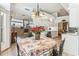 Open-concept dining area with views of the kitchen and living room at 13553 Glaze Brook Dr, Hudson, FL 34667