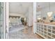 Open-concept entryway with tile flooring, glass block wall, and natural light at 13553 Glaze Brook Dr, Hudson, FL 34667