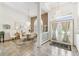 Bright entryway with tile floors, glass block, and a dining area view at 13553 Glaze Brook Dr, Hudson, FL 34667