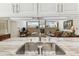 Spacious open kitchen with bar height seating looking into an open living room at 13553 Glaze Brook Dr, Hudson, FL 34667
