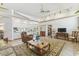 Bright living room with open floor plan and access to the kitchen at 13553 Glaze Brook Dr, Hudson, FL 34667