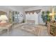 Cozy living room boasts a display cabinet, neutral carpet, and elegant accents at 13553 Glaze Brook Dr, Hudson, FL 34667