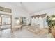 Bright living room with neutral colors and seamless access to main bedroom at 13553 Glaze Brook Dr, Hudson, FL 34667