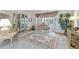 Relaxing living room with pool view, bright carpet, and stylish decor at 13553 Glaze Brook Dr, Hudson, FL 34667