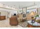 Cozy living room with ceiling fan, fireplace, and comfortable seating at 13553 Glaze Brook Dr, Hudson, FL 34667
