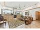 Spacious living room with fireplace, large windows, and natural light at 13553 Glaze Brook Dr, Hudson, FL 34667