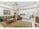 Open living room with views of the kitchen and dining area at 13553 Glaze Brook Dr, Hudson, FL 34667