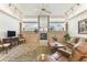 Bright living room featuring fireplace, recessed lighting, and large windows at 13553 Glaze Brook Dr, Hudson, FL 34667