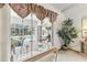 Patio entrance with pool view, natural light, and stylish table setting at 13553 Glaze Brook Dr, Hudson, FL 34667